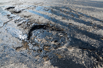 Road repair. Hole in  asphalt and bitumen