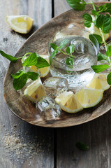 Fresh mojito with lemon, mint, ice and sugar, selective focus