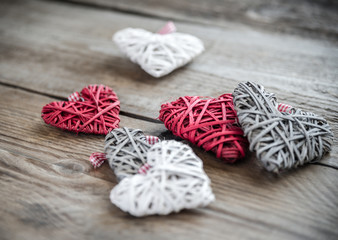 Handmade retro hearts on the wooden background