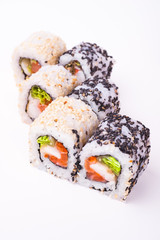 salmon sushi roll in sesame seeds