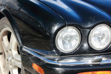 Black Car bonnet and round Headlights jaguar automobile	