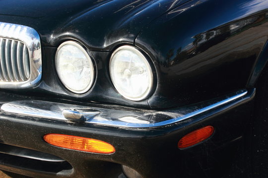Black Car bonnet and round Headlights jaguar automobile	