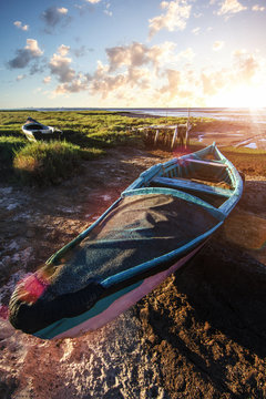 View of an old abandoned fishing boat on the marshlands.