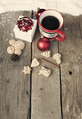 Mulled wine and Christmas decorations on vintage wooden table