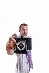 Fototapeta premium young man with a retro vintage photographic camera