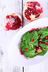 Fresh salad with greens, garnet and spices