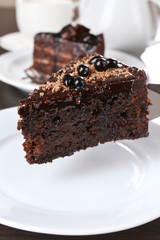 Yummy chocolate cake served on table, close-up