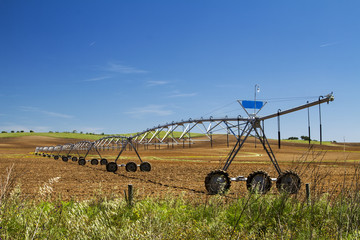 View of a industrial irrigation equipment on a field.