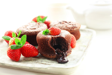 Hot chocolate pudding with fondant centre with strawberries,