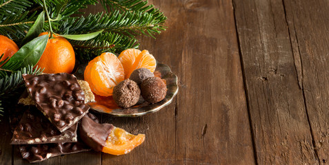 Obraz na płótnie Canvas Chocolate, truffles and tangerins