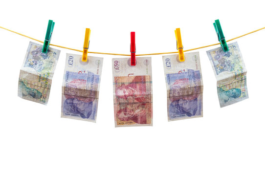 English pounds banknotes on clothesline