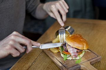 Tasty big burger with chips