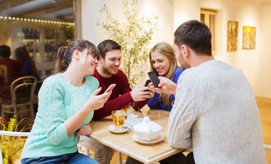 group of friends with smartphones meeting at cafe
