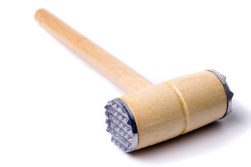 Close up view of a meat hammer isolated on a white background.
