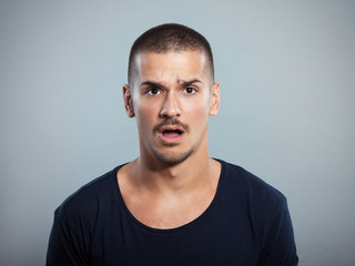 Fototapeta premium Studio shot of shocked young man 