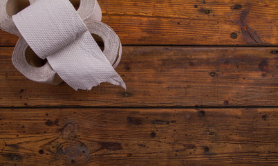 Toilet paper on a wooden table