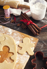 Fototapeta na wymiar Making gingerbread cookies. Christmas baking background dough an