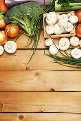 Different vegetables in boxes on wooden background top view