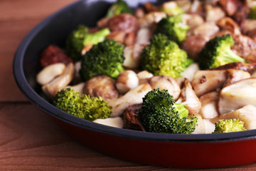 Braised wild mushrooms with vegetables and spices in pan