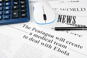 On-line news and business concept. Computer mouse, calculator