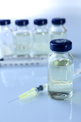 Vaccine in vial with syringe
