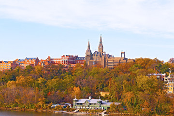 Georgetown University buildings in fall along the Potomac River