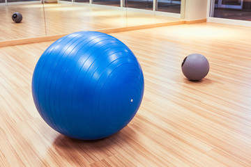 exercise ball for fitness on wooden floor