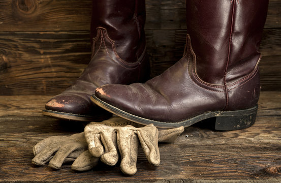 Cowboy boots and leather gloves.