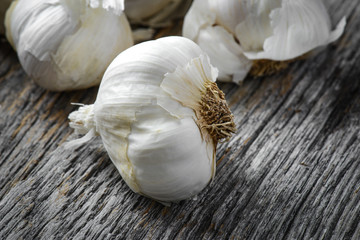 Garlic Bulb Close Up on Rustic Wood Background
