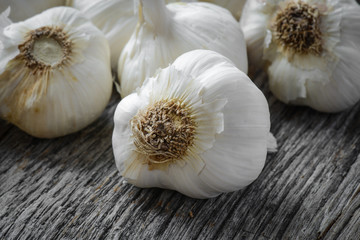 Garlic Bulb Close Up on Rustic Wood Background