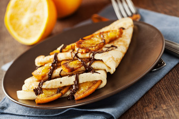 Obraz na płótnie Canvas Crepes Suzette - thin pancakes with orange sauce