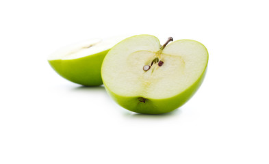 Green apple slice defocused on white background