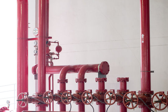 pipe system, red pipe system attached on wall building