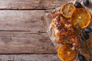 roasted rabbit leg with oranges and olives horizontal top view