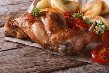 delicious grilled rabbit leg with apples and tomatoes