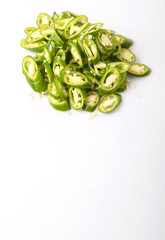 Green chili peppers over white background 