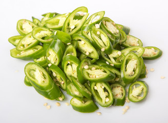 Green chili peppers over white background 