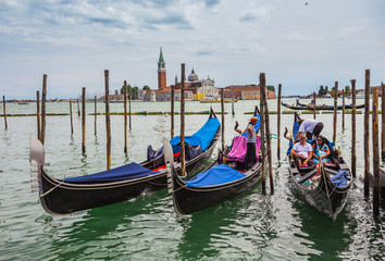 Obraz na płótnie Canvas Gondolas moored by Saint Mark square