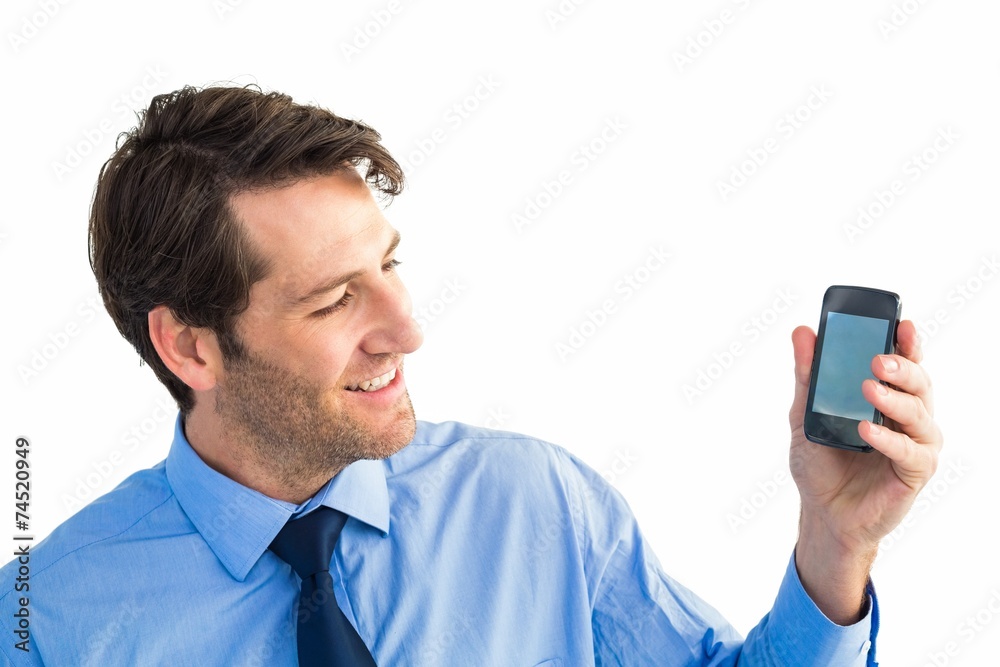Poster smiling businessman showing smartphone to camera