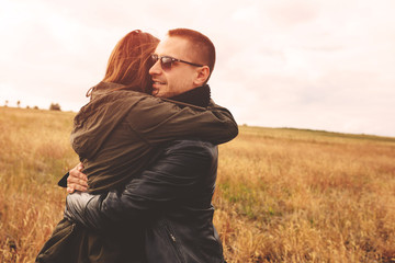 Landscape portrait of young beautiful stylish couple sensual and