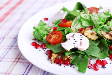 Fresh salad with greens, garnet and spices