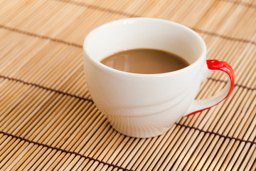 Fototapeta na wymiar Cup of hot coffee on wooden table.