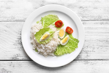 Boiled rice served on table, close-up