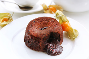 Hot chocolate pudding with fondant centre on plate, close-up