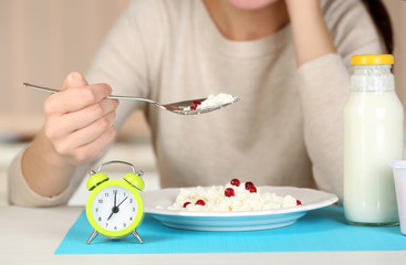 Girl eating diet food at table close-up