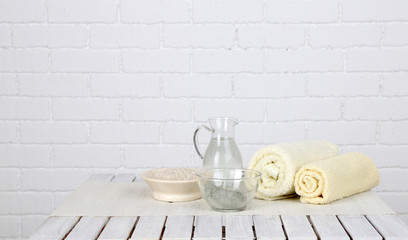 Spa treatment on color wooden table, on light background