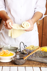 Beautician makes cosmetic facial masks, close-up