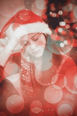 Composite image of festive brunette feeling sad at christmas