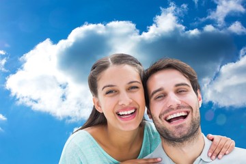 Fototapeta premium Composite image of cute couple smiling at camera