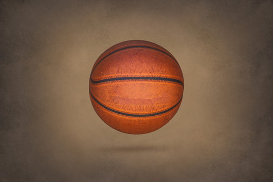 Old basketball on grunge texture background